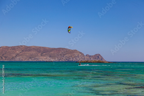 Kite surfer at famous Elafonisi beach in southern Crete, Greece.