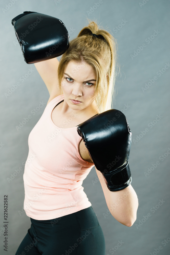 Woman wearing boxing gloves