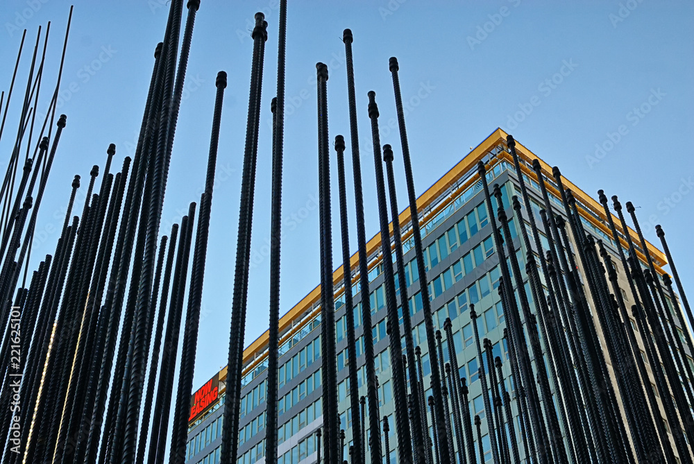 Obraz premium Steel rebar rising up to form a building under construction