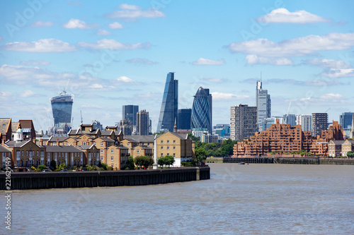 The skyscrapers of London s financial centre in the background across the River Thames