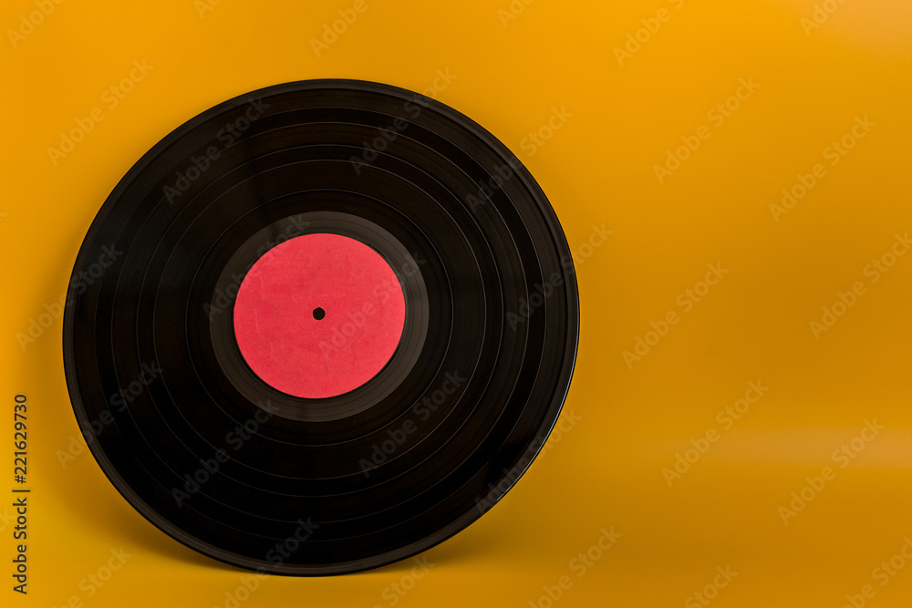 vinyl black plate with red center on yellow background vinyl black plate with red center on yellow background