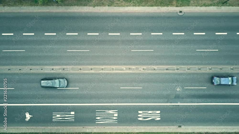 Low altitude aerial top down view of city highway with bus lanes Low altitude aerial top down view of city highway with bus lanes