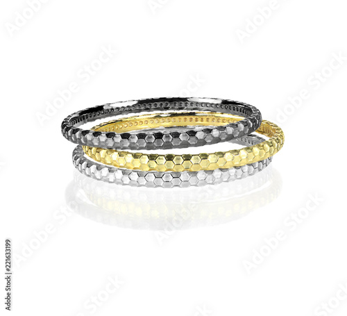Grouping of metal bangle Bracelets isolated on white with a reflection