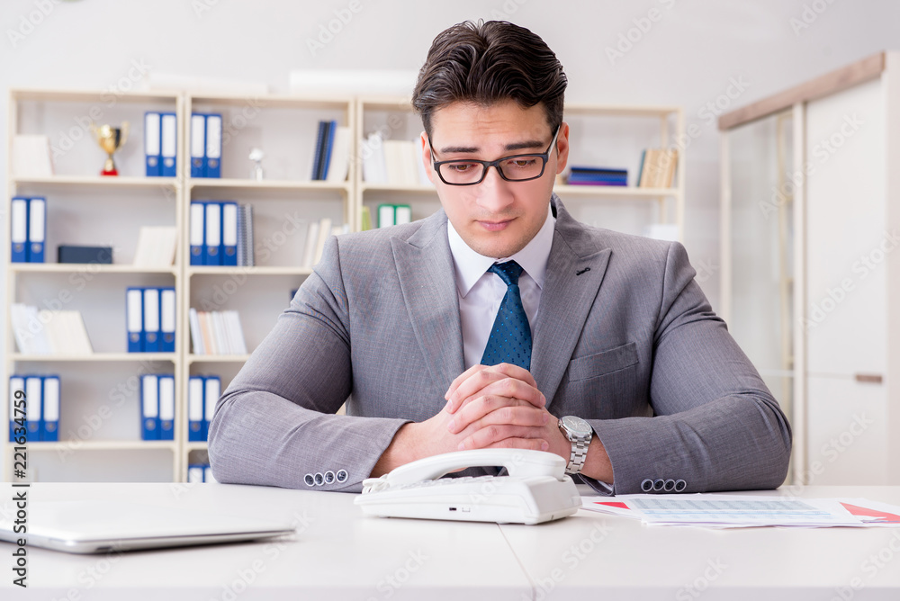 Businessman expecting important call on phone Businessman expecting important call on phone