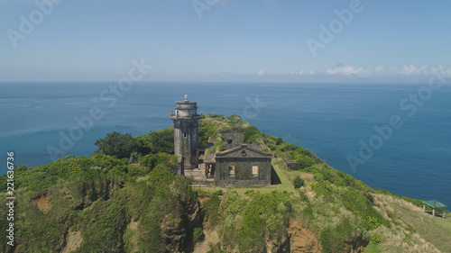 Aerial view of lighthouse in Palau island. Lighthouse in cape Engano against blue sky, province of Cagayan, Philippines.