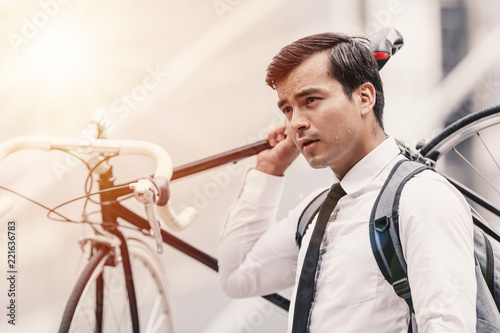 Business man worker carrying bicycle in city,Concept ecology bike go to worker