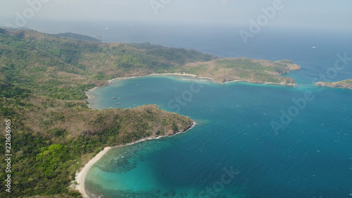 Aerial view of seashore with beach, lagoons and coral reefs. Philippines, Luzon. Coast ocean with tropical beach, turquoise water. Tropical landscape in Asia. © Alex Traveler