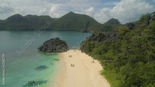 Aerial view with sand beach and turquoise water, Matukad island, Caramoan, Philippines. Landscape with sea, tropical beach. photo