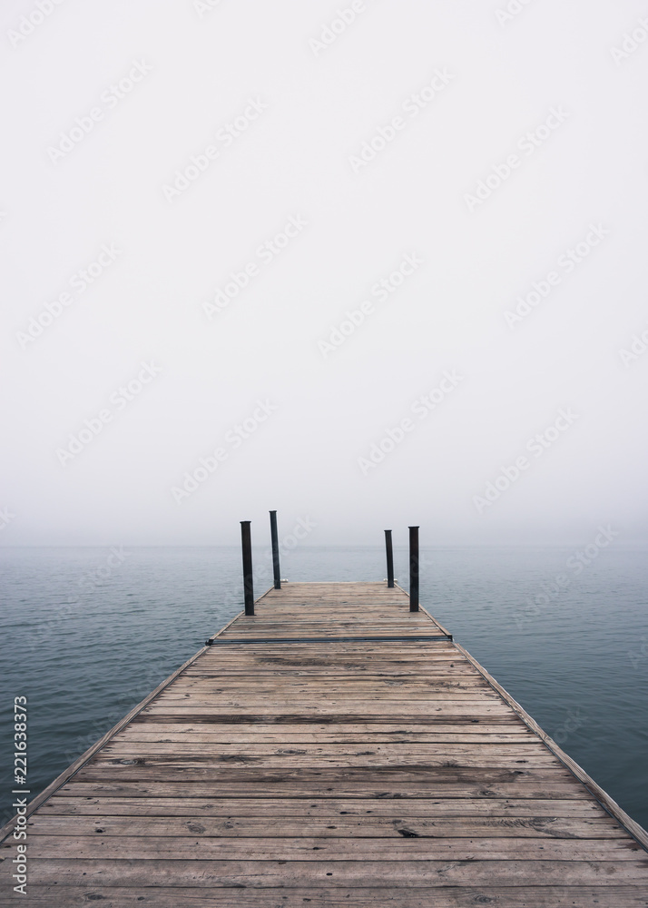 pier on the lake in the fog