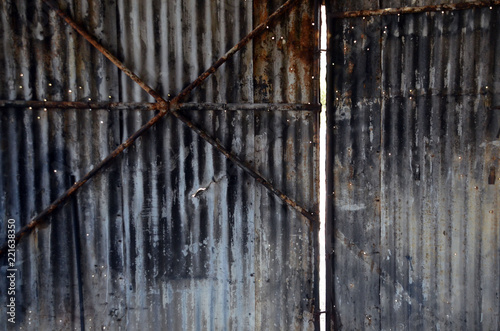 corrugated metal door and wall of old repair garage