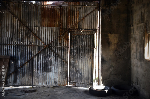 corrugated metal door and wall of old repair garage