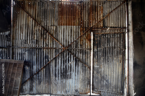 corrugated metal door and wall of old repair garage