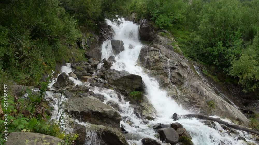 View waterfall scenes in mountains, national park Dombai, Caucasus, Russia. Summer landscape, sunshine weather and sunny day View waterfall scenes in mountains, national park Dombai, Caucasus, Russia. Summer landscape, sunshine weather and sunny day