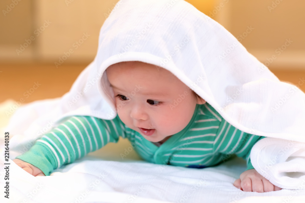Baby boy playing with a blanket in his house Baby boy playing with a blanket in his house