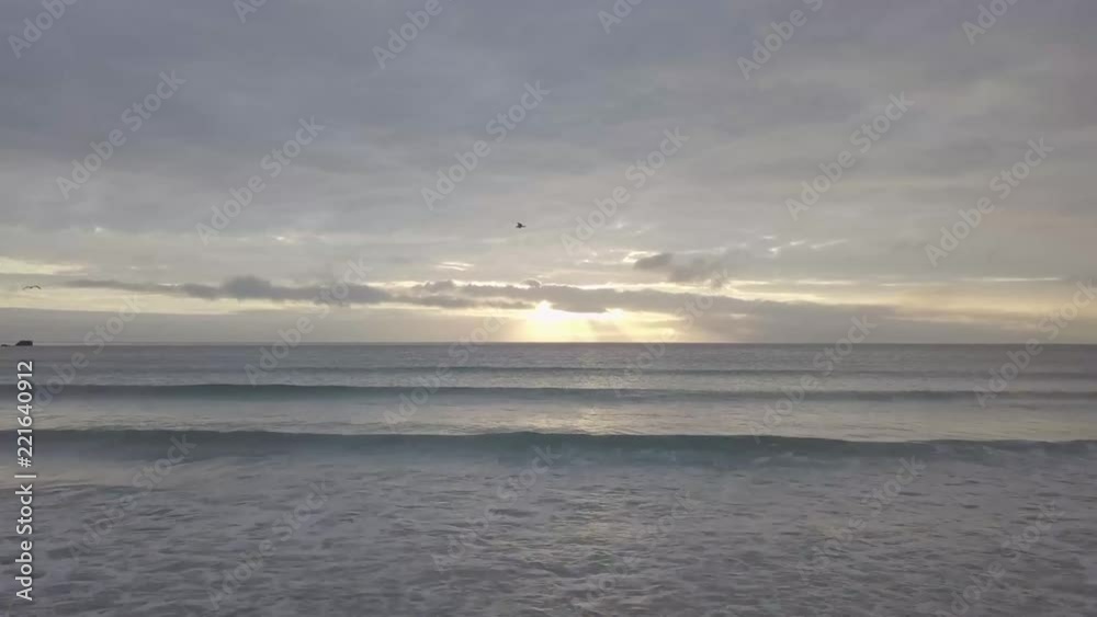 Magical sunset at the beach. Light beam shining through cloudscape over seascape. Fast dron flying (4k, 30fps) Magical sunset at the beach. Light beam shining through cloudscape over seascape. Fast dron flying (4k, 30fps)