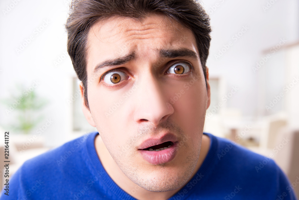 Fototapeta premium Young handsome man looking scared and surprised