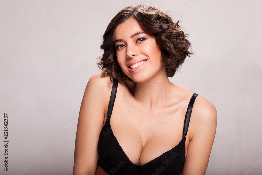 Photo of beautiful sensual woman in black bra, showing face expression Photo of beautiful sensual woman in black bra, showing face expression