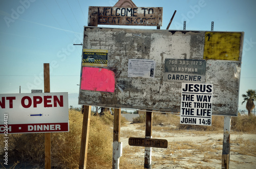 Billboard at Salton Sea with flyers