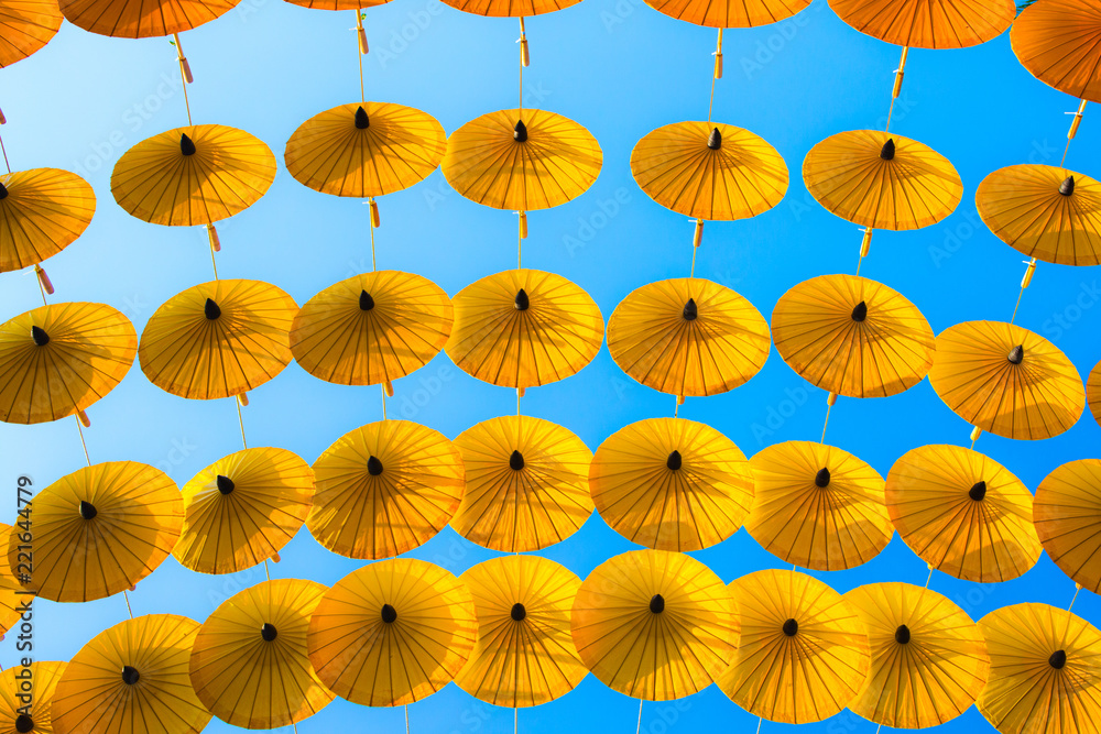 Pattern Yellow umbrellas on blue sky.