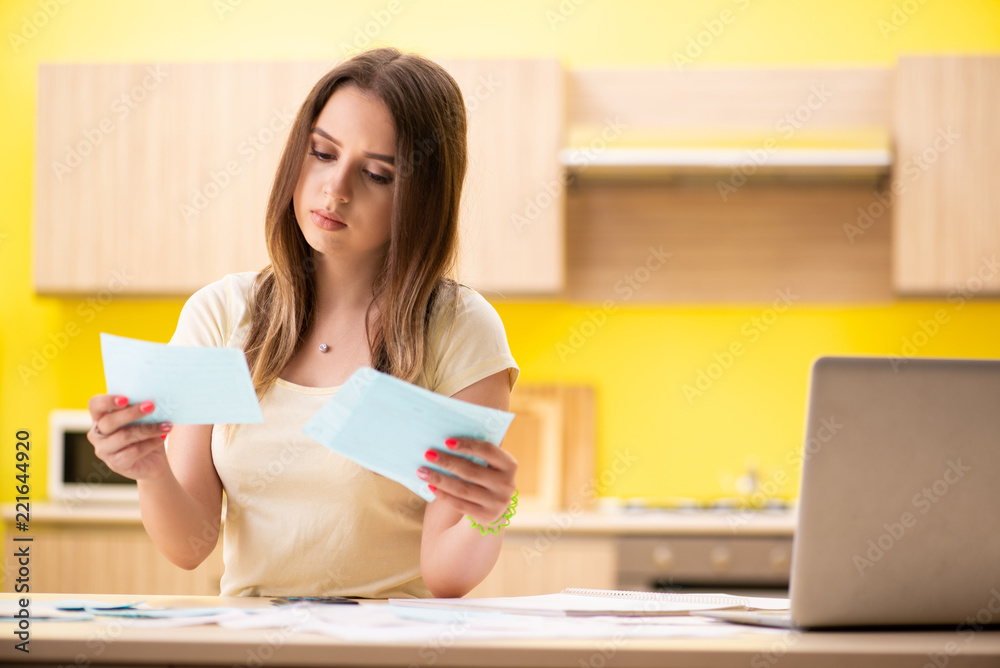 Young woman wife in budget planning concept