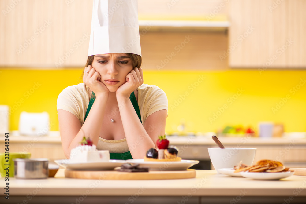 Young cook cooking cakes in the kitchen Young cook cooking cakes in the kitchen
