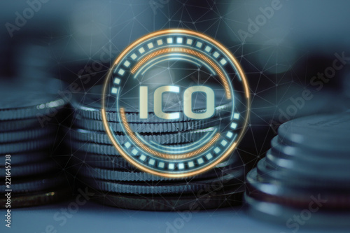 Initial Coin Offering (ICO) hologram hover over pile of regular coins. Illustration of solution to new economic system concept. For promoting new coin tokens and crypto currency photo