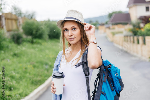 women travelling in a city using map, bags and making photos