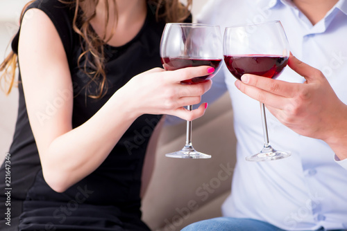 Young pair drinking wine in romantic concept