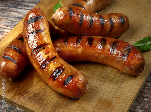 grilled sausages on a cutting board