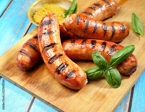 grilled sausages on a cutting board