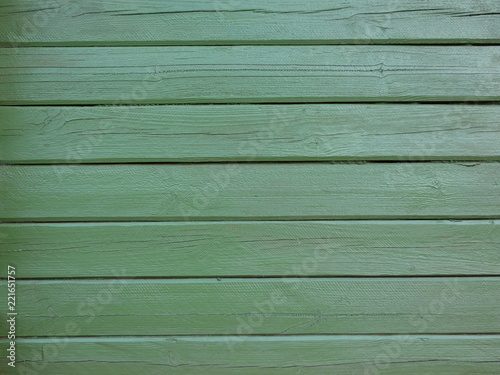 Wall of green wooden planks