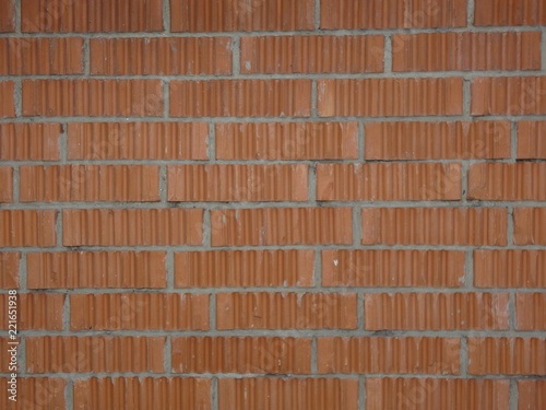 Wall of relief orange bricks