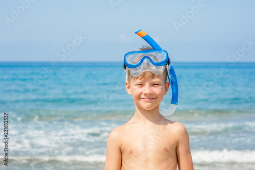 Boy in snorkelling mask at beach. Space for text