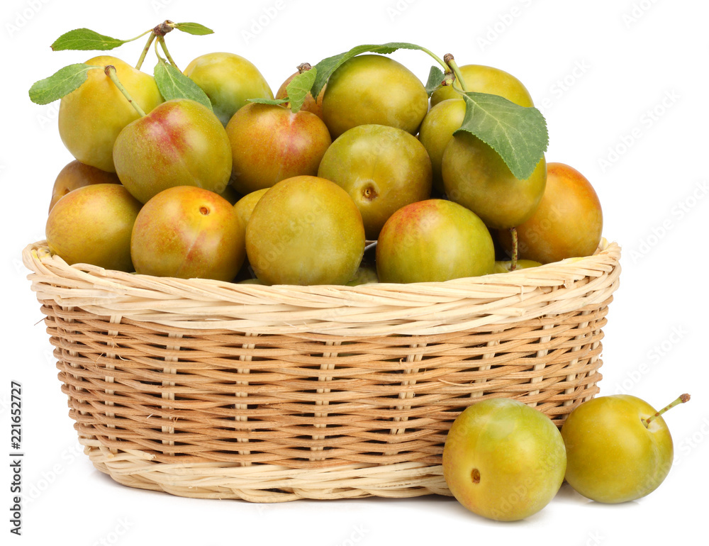 White plums in busket isolated on white background White plums in busket isolated on white background