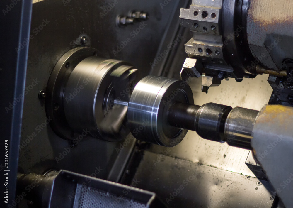 CNC lathe pulls out part of metal workpiece pulley, modern lathe for metal processing, close-up, machine CNC lathe pulls out part of metal workpiece pulley, modern lathe for metal processing, close-up, machine