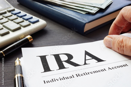 Fototapeta Documents about Individual retirement account IRA on a desk.