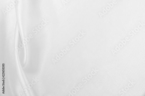 Smooth elegant white silk or satin luxury cloth texture as wedding background. Luxurious background design