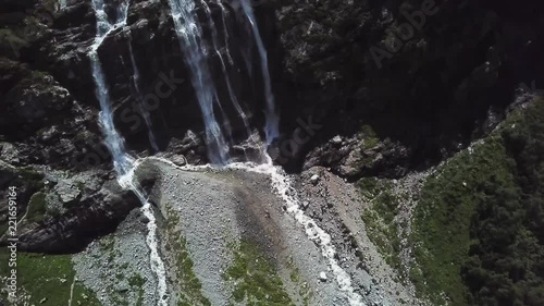 Top view of the mountain waterfall on a Sunny day. Amazing view of the waterfall from the top of the mountain photo