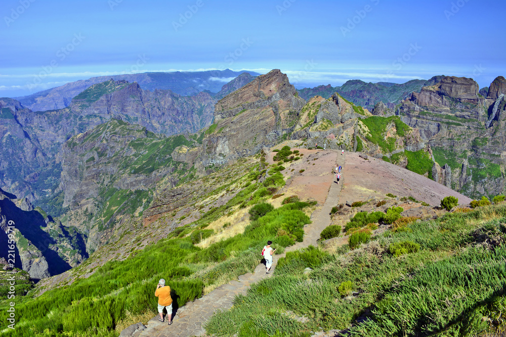 Tourists at the top of Pico do Arieiro one of the highest peaks in Madeira island. Hiking trail from Pico do Arieiro to Pico Ruivo.
