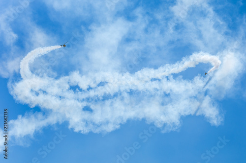 Gyrocopter or autogyro in flight in the blue sky at Air Show Mazury 2018 event at the lake Niegocin in Gizycko. Poland. photo