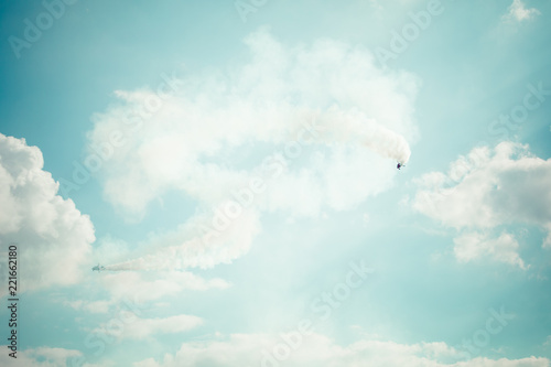 Fototapeta Naklejka Na Ścianę i Meble -  Gyrocopter or autogyro in flight in the blue sky at Air Show Mazury 2018 event at the lake Niegocin in Gizycko. Poland.