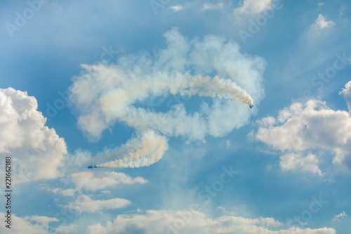 Fototapeta Naklejka Na Ścianę i Meble -  Gyrocopter or autogyro in flight in the blue sky at Air Show Mazury 2018 event at the lake Niegocin in Gizycko. Poland.