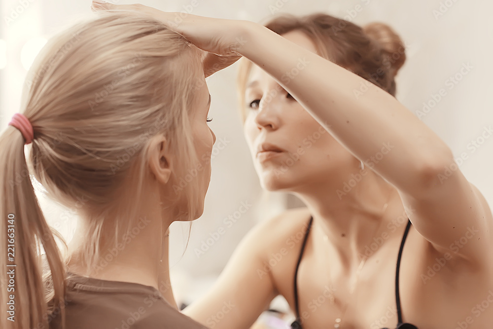 professional make-up in the beauty salon / master makes a professional fresh summer make-up of a beautiful model in the salon professional make-up in the beauty salon / master makes a professional fresh summer make-up of a beautiful model in the salon
