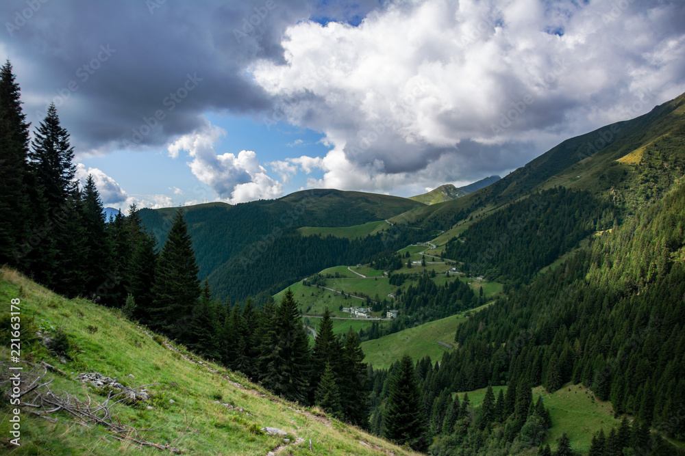 Mountain valley in Italy with clouds in the sky