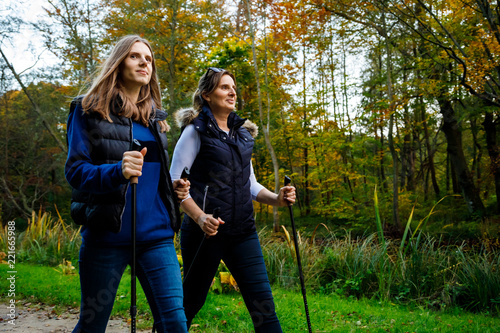 Nordic walking - active people working out in park