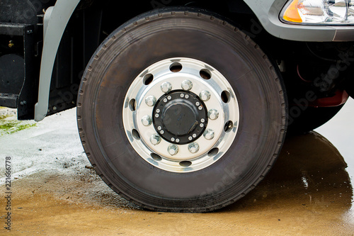 Closeup view of a rubber tire on a truck.Truck Wheels and Tires Closeup Photo. Heavy Duty Truck Wheels.