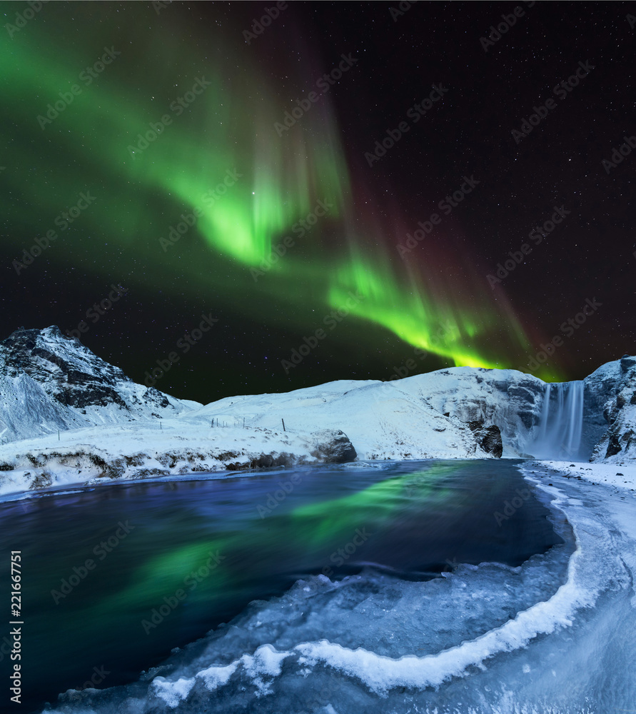 Obraz premium Aurora borealis, northern lights in Iceland during winter.