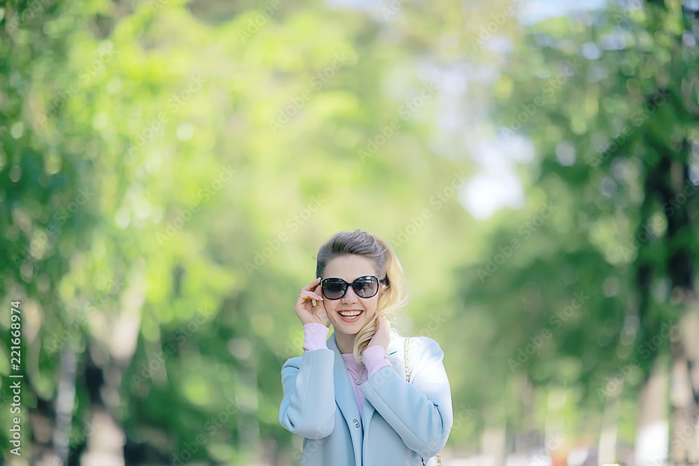 summer girl outdoor air / cheerful adult girl model on a summer walk in the city park, happiness, pleasure freedom summer girl outdoor air / cheerful adult girl model on a summer walk in the city park, happiness, pleasure freedom