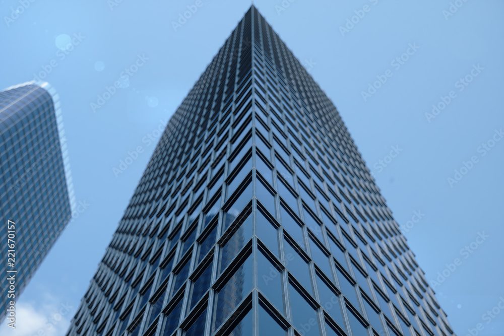 3D Illustration blue skyscrapers from a low angle view. Architecture glass high buildings. Blue skyscrapers in a finance district 3D Illustration blue skyscrapers from a low angle view. Architecture glass high buildings. Blue skyscrapers in a finance district