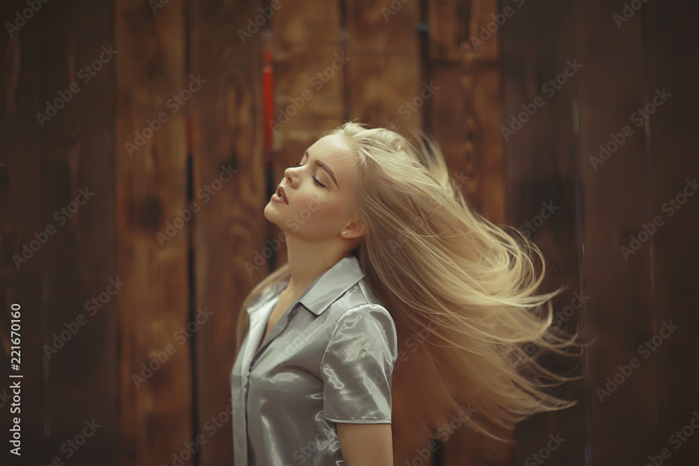 Home portrait of a young blonde girl
